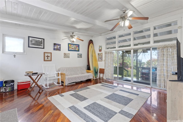 sitting room featuring hardwood / wood-style flooring, a ceiling fan, a healthy amount of sunlight, and arched walkways