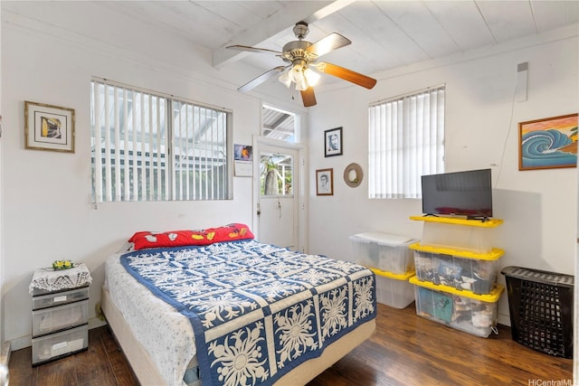 bedroom featuring a ceiling fan, beamed ceiling, wooden ceiling, and wood finished floors