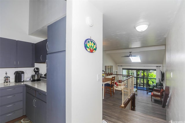 45-995 Wailele Rd Unit 8, Kaneohe, HI 96744 - kitchen with freestanding refrigerator, a ceiling fan, wood finished floors, tile counters, and gray cabinets