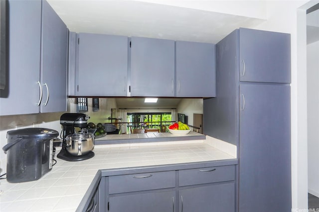 45-995 Wailele Rd Unit 8, Kaneohe, HI 96744 - kitchen featuring tile countertops and gray cabinets