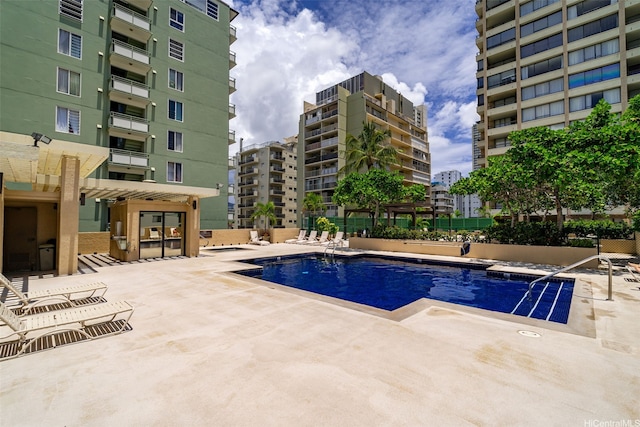 pool with a patio area