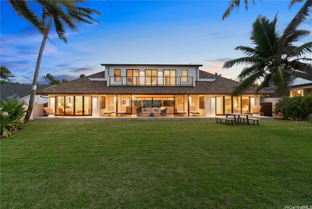 21 Kalaka Pl, Kailua, HI 96734 - rear view of property with outdoor lounge area, a lawn, and a shingled roof
