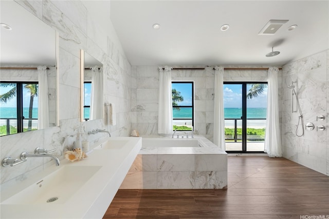 21 Kalaka Pl, Kailua, HI 96734 - full bathroom featuring tile walls, plenty of natural light, a sink, a garden tub, and recessed lighting