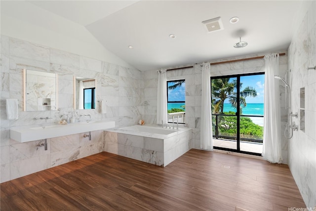 21 Kalaka Pl, Kailua, HI 96734 - full bathroom with vaulted ceiling, tile walls, wood finished floors, a sink, and a bathtub