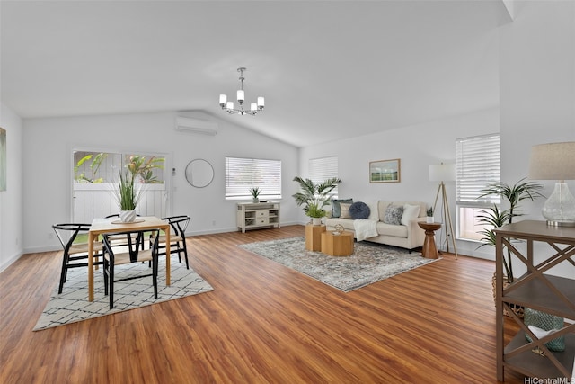 91-113 Kaakina Pl, Ewa Beach, HI 96706 - living room featuring plenty of natural light, a chandelier, a wall mounted air conditioner, vaulted ceiling, and wood finished floors
