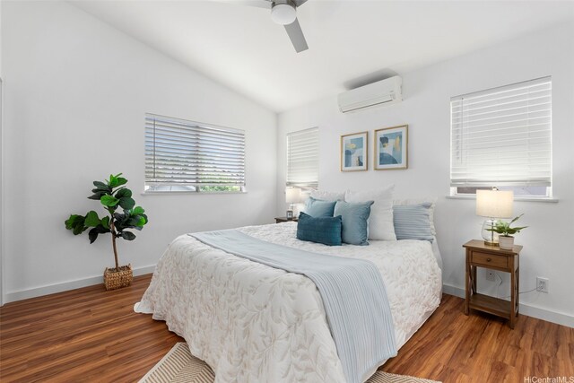 91-113 Kaakina Pl, Ewa Beach, HI 96706 - bedroom featuring an AC wall unit, wood finished floors, lofted ceiling, ceiling fan, and baseboards