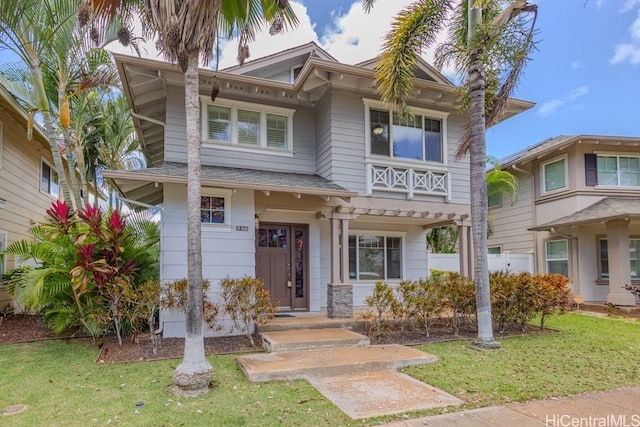 91-1040 Kaihohonu St, Ewa Beach, HI 96706 - view of front of property with a front lawn and roof with shingles