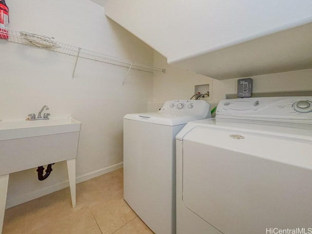 91-1040 Kaihohonu St, Ewa Beach, HI 96706 - laundry room featuring independent washer and dryer, light tile patterned floors, and baseboards