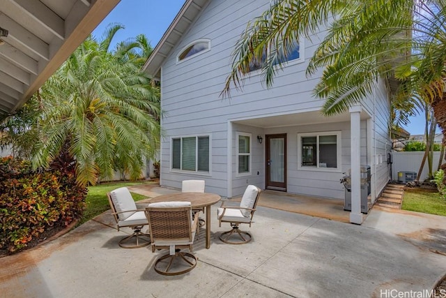 91-1040 Kaihohonu St, Ewa Beach, HI 96706 - view of patio featuring outdoor dining space, central air condition unit, and fence