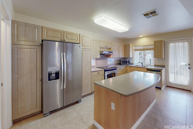 91-1040 Kaihohonu St, Ewa Beach, HI 96706 - kitchen with appliances with stainless steel finishes, light brown cabinets, a sink, and light tile patterned floors