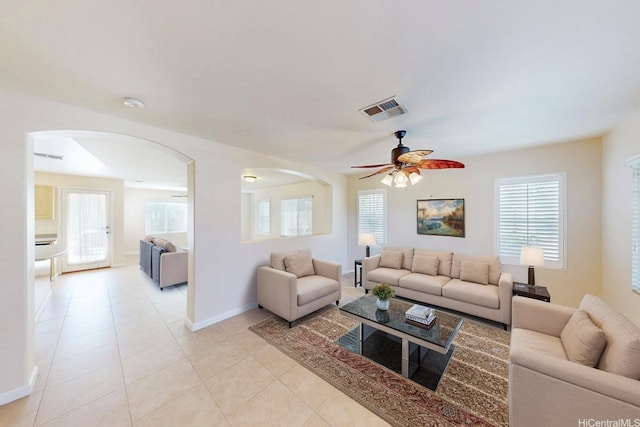91-1040 Kaihohonu St, Ewa Beach, HI 96706 - living area with arched walkways, a ceiling fan, light tile patterned floors, and baseboards