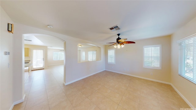 91-1040 Kaihohonu St, Ewa Beach, HI 96706 - unfurnished room featuring ceiling fan, arched walkways, light tile patterned floors, baseboards, and a smoke detector