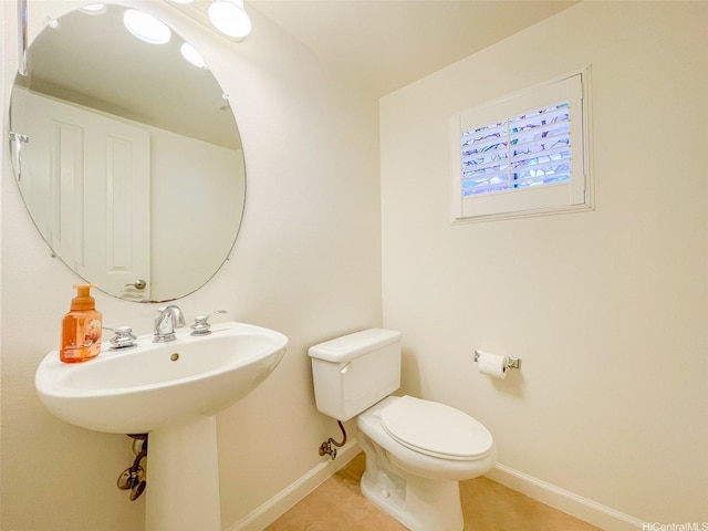 91-1040 Kaihohonu St, Ewa Beach, HI 96706 - half bath with baseboards, toilet, and tile patterned flooring