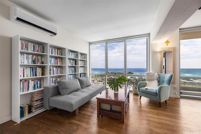 1391 Kapiolani Blvd Unit 2512, Honolulu, HI 96814 - living area featuring a wall mounted AC, a wall of windows, wood finished floors, and a water view