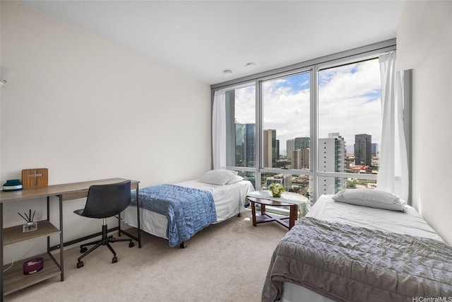 1391 Kapiolani Blvd Unit 2512, Honolulu, HI 96814 - carpeted bedroom featuring a view of skyline, expansive windows, and an office area
