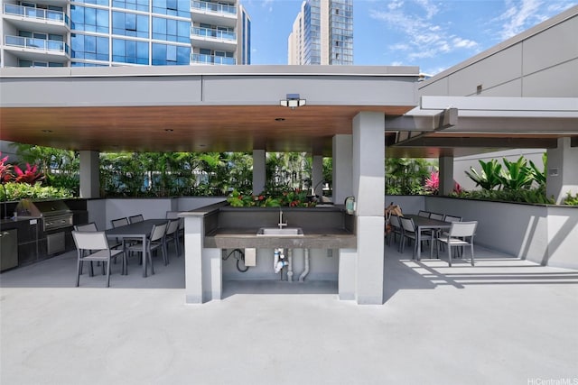 1391 Kapiolani Blvd Unit 2512, Honolulu, HI 96814 - view of patio with outdoor dining space, a grill, and area for grilling