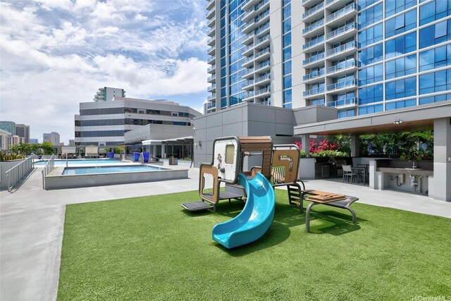 1391 Kapiolani Blvd Unit 2512, Honolulu, HI 96814 - surrounding community with a swimming pool, a patio area, and a view of city