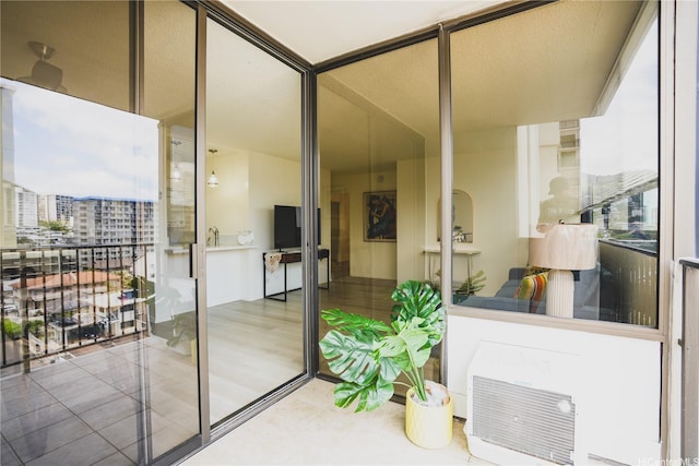 entrance to property with a balcony