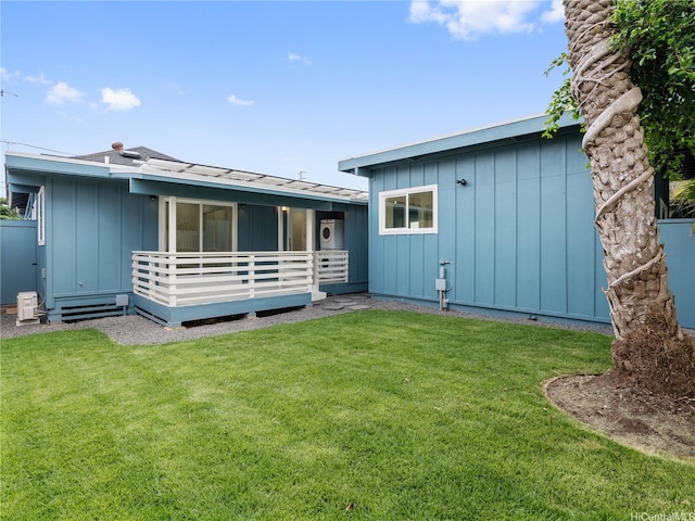 54-11 Pipilani Pl, Hauula, HI 96717 - rear view of property with a yard, board and batten siding, and a wooden deck