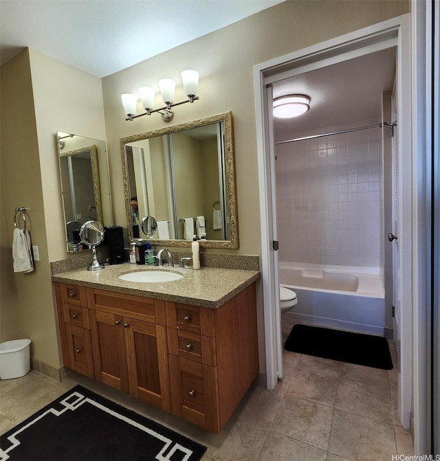 bathroom with toilet, tile patterned flooring, vanity, and bathing tub / shower combination