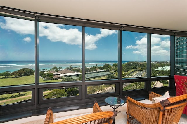 sunroom with a water view