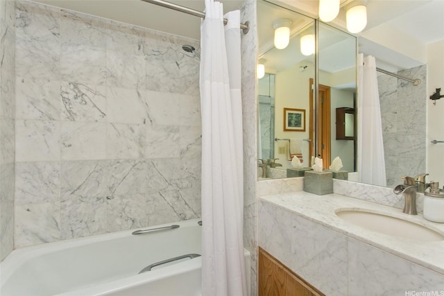 full bath with shower / tub combo and vanity