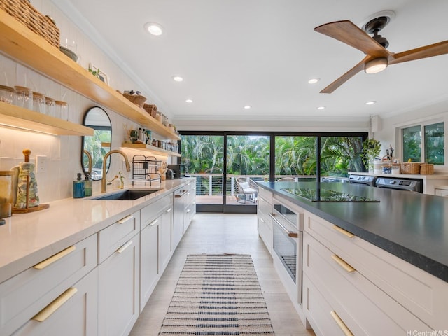 567 Kawailoa Rd Unit E, Kailua, HI 96734 - kitchen with a sink, oven, open shelves, white cabinets, and a ceiling fan