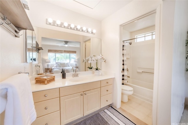 full bath with toilet, ensuite bathroom, vanity, shower / bathtub combination with curtain, and a ceiling fan