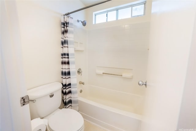 bathroom with toilet and shower / tub combo