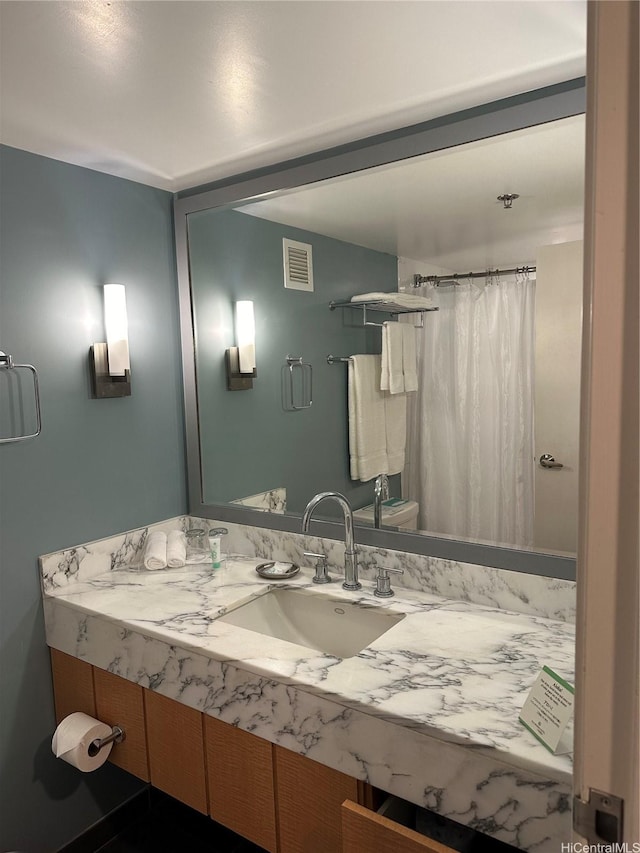 bathroom with vanity and a shower with shower curtain