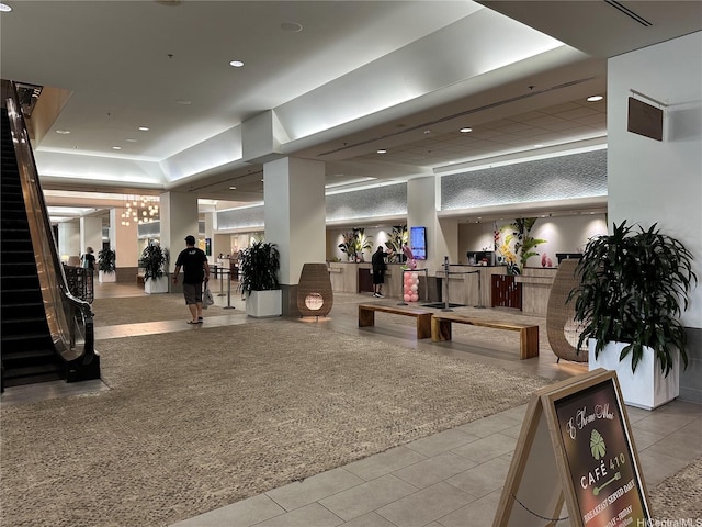 welcome area featuring stairway and recessed lighting