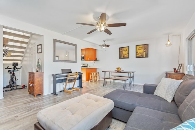 92-1044 Kanehoa Loop Unit 85, Kapolei, HI 96707 - living area featuring a ceiling fan, light wood-style flooring, and baseboards