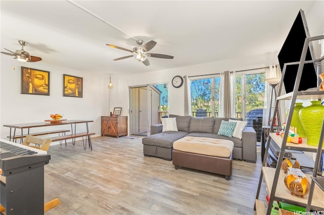 92-1044 Kanehoa Loop Unit 85, Kapolei, HI 96707 - living room with a ceiling fan and light wood finished floors