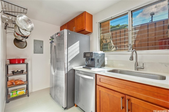 92-1044 Kanehoa Loop Unit 85, Kapolei, HI 96707 - kitchen featuring appliances with stainless steel finishes, a sink, electric panel, light countertops, and brown cabinetry