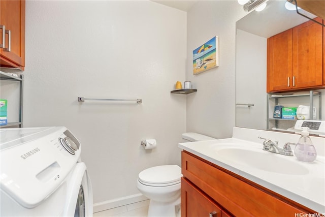 92-1044 Kanehoa Loop Unit 85, Kapolei, HI 96707 - bathroom featuring washer / dryer, toilet, vanity, tile patterned floors, and baseboards