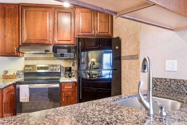 1088 Bishop St Unit 2006, Honolulu, HI 96813 - kitchen with black appliances, extractor fan, a sink, light stone countertops, and brown cabinets