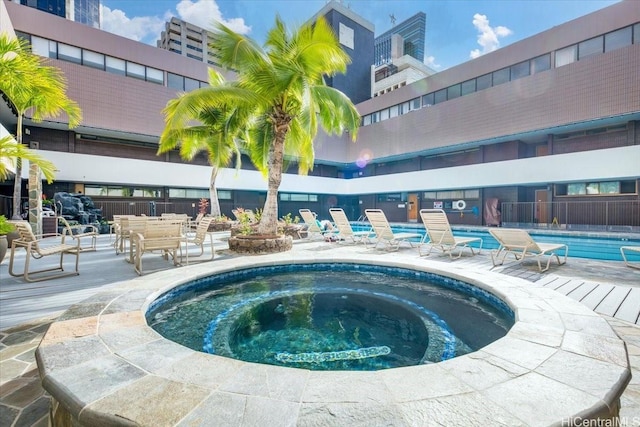 1088 Bishop St Unit 3706, Honolulu, HI 96813 - community pool featuring a hot tub and a patio area