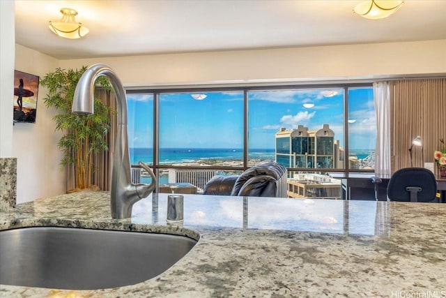 1088 Bishop St Unit 3706, Honolulu, HI 96813 - kitchen featuring a sink and stone countertops
