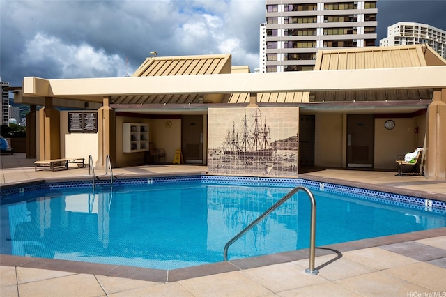 community pool featuring a patio area
