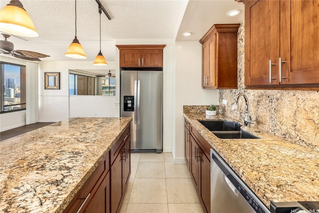 1778 Ala Moana Blvd Unit 3411, Honolulu, HI 96815 - kitchen featuring stainless steel appliances, a sink, backsplash, light stone counters, and a textured ceiling