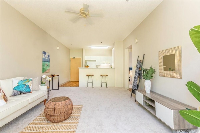 3009 Ala Makahala Pl Unit 102, Honolulu, HI 96818 - living room featuring light colored carpet and ceiling fan