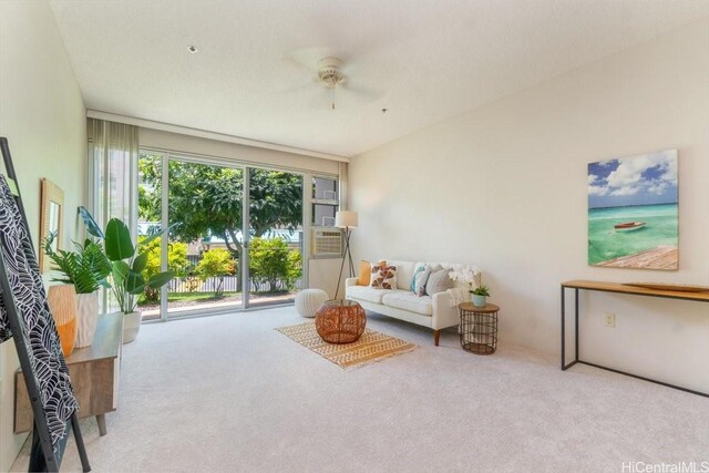 3009 Ala Makahala Pl Unit 102, Honolulu, HI 96818 - living area featuring carpet flooring and ceiling fan