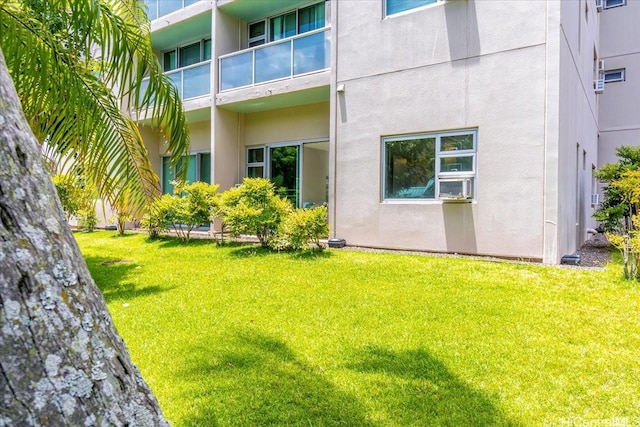 3009 Ala Makahala Pl Unit 102, Honolulu, HI 96818 - exterior space featuring stucco siding and a lawn