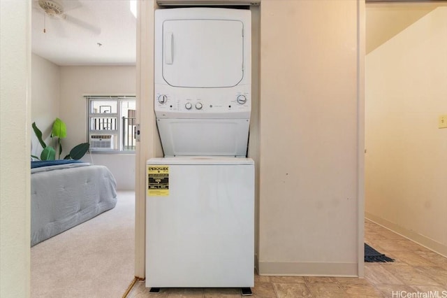 3009 Ala Makahala Pl Unit 102, Honolulu, HI 96818 - washroom featuring stacked washer / dryer, baseboards, and a ceiling fan