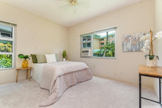 3009 Ala Makahala Pl Unit 102, Honolulu, HI 96818 - bedroom featuring multiple windows, carpet flooring, a ceiling fan, and cooling unit