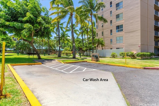 3009 Ala Makahala Pl Unit 102, Honolulu, HI 96818 - surrounding community with uncovered parking and a lawn