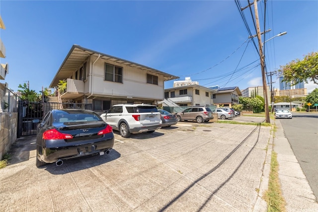 1671 Citron St, Honolulu, HI 96826 - view of front of property featuring uncovered parking and fence