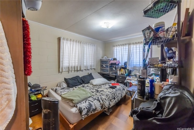 1671 Citron St, Honolulu, HI 96826 - bedroom featuring wood finished floors and concrete block wall