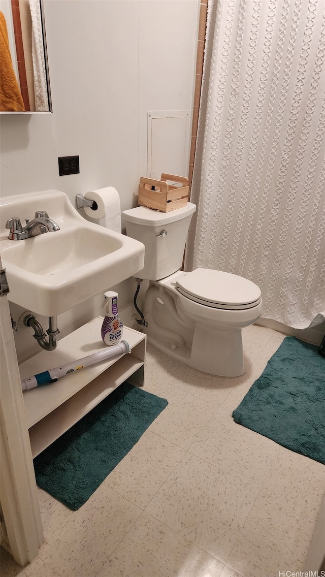 1671 Citron St, Honolulu, HI 96826 - bathroom with toilet, a shower with shower curtain, and a sink