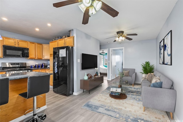 3003 Ala Napuaa Pl Unit 401, Honolulu, HI 96818 - living area with a ceiling fan, light wood-style floors, recessed lighting, and baseboards
